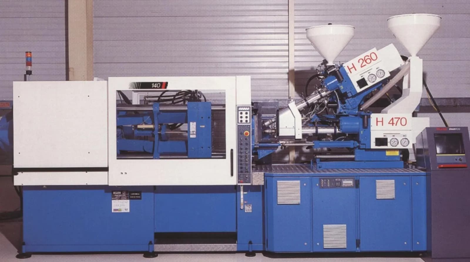Blue and white two-component injection moulding machine with twin material hoppers