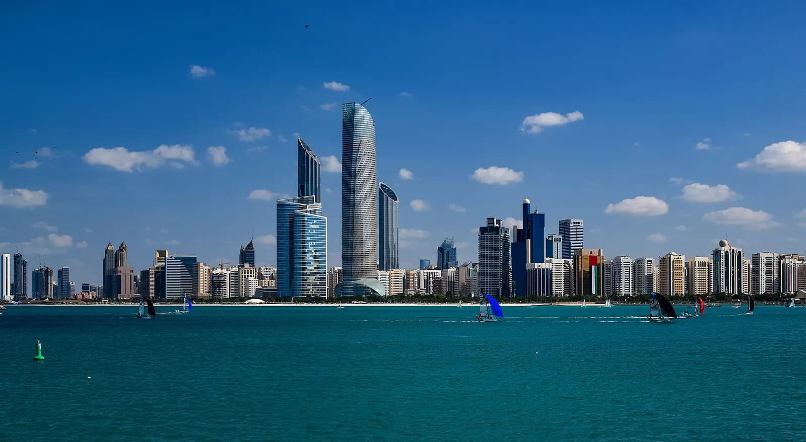 Abu Dhabi skyline seen across the water from the Corniche on a clear day