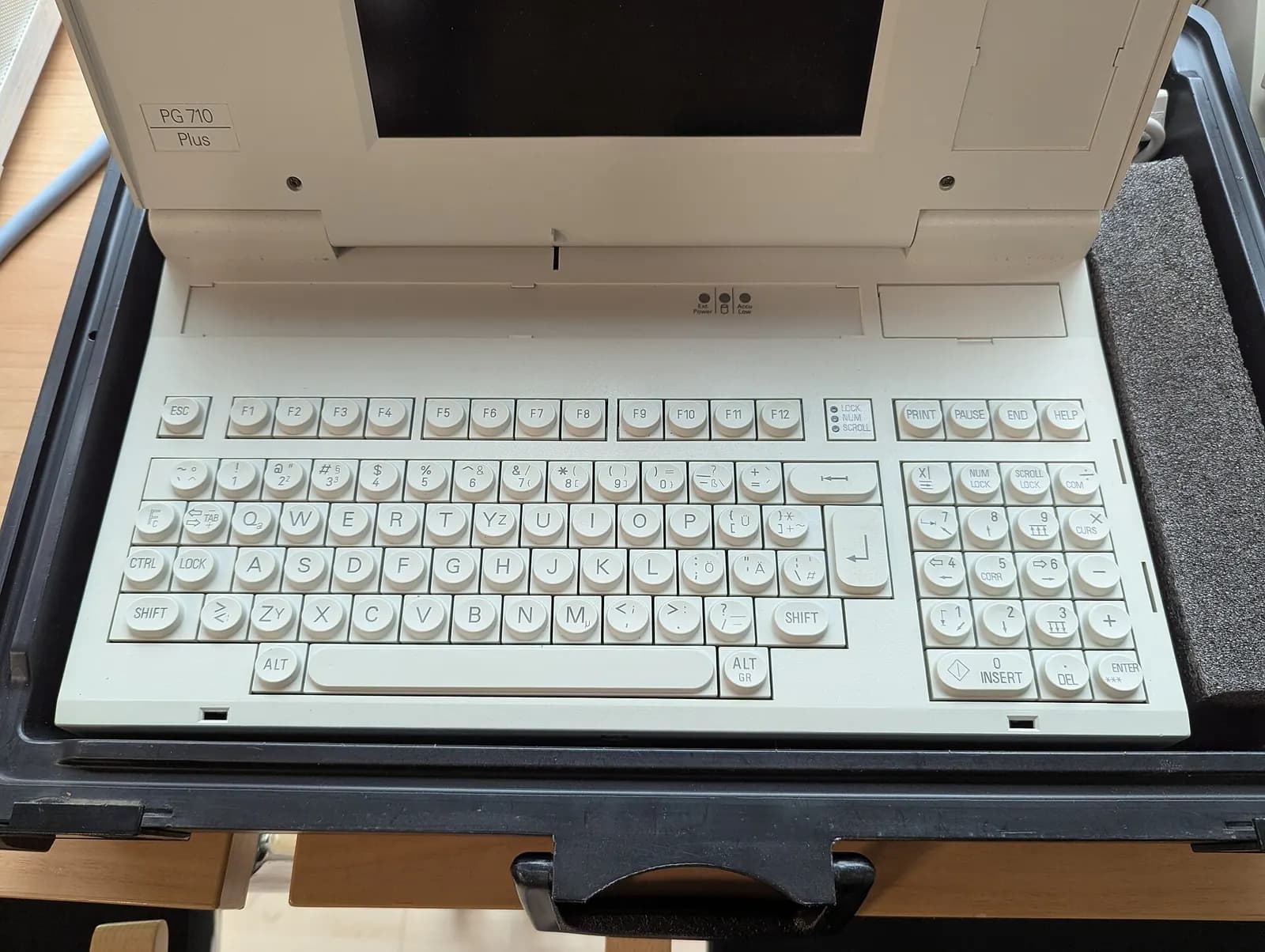 Siemens SIMATIC PG 710 Plus portable programming device opened in its carrying case, showing the keyboard and screen