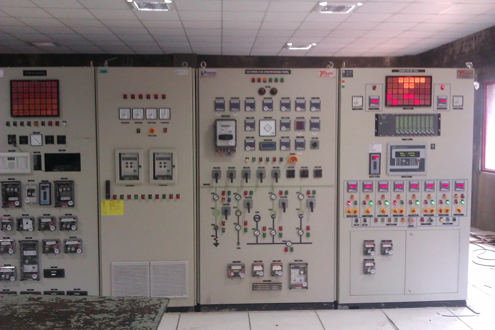 Electrical control and protection panels with meters and indicator lamps at a co-generation plant in Maharashtra