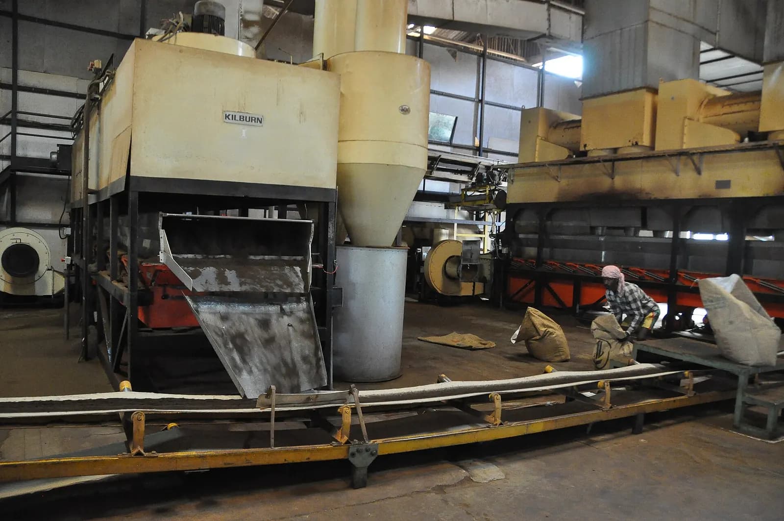 CTC tea packing section in a tea factory in Munnar, Kerala, with machines and filled sacks