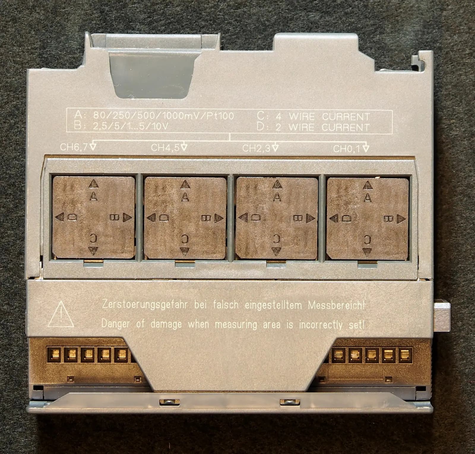 Siemens SM331 analogue input module for the S7-300 range, shown from the side with its front connector