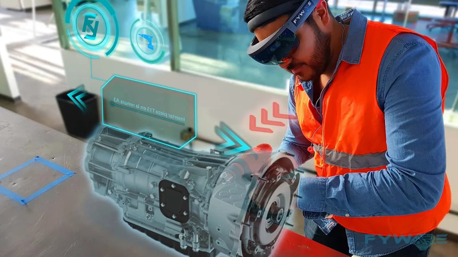 Worker in an orange safety vest wearing a mixed reality headset while inspecting a gearbox with digital overlays