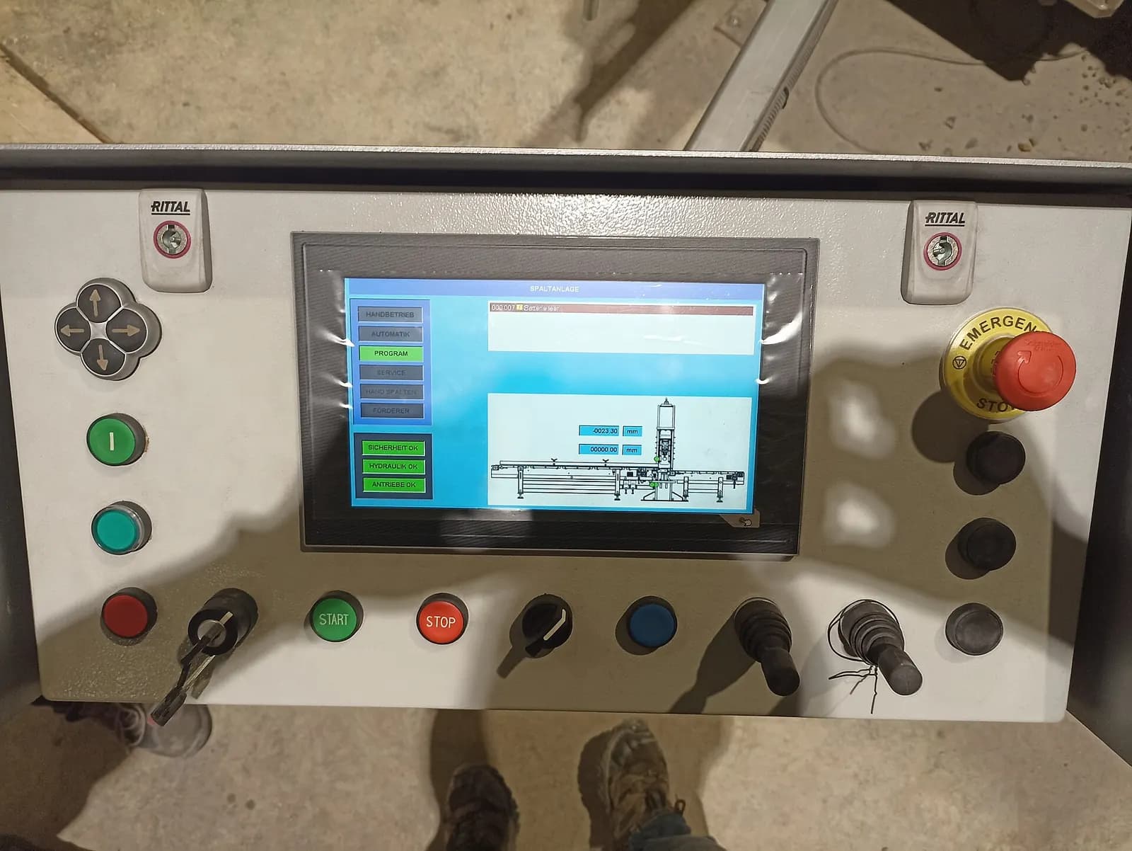 Machine operator panel with touchscreen HMI, selector switches, pushbuttons and an emergency stop