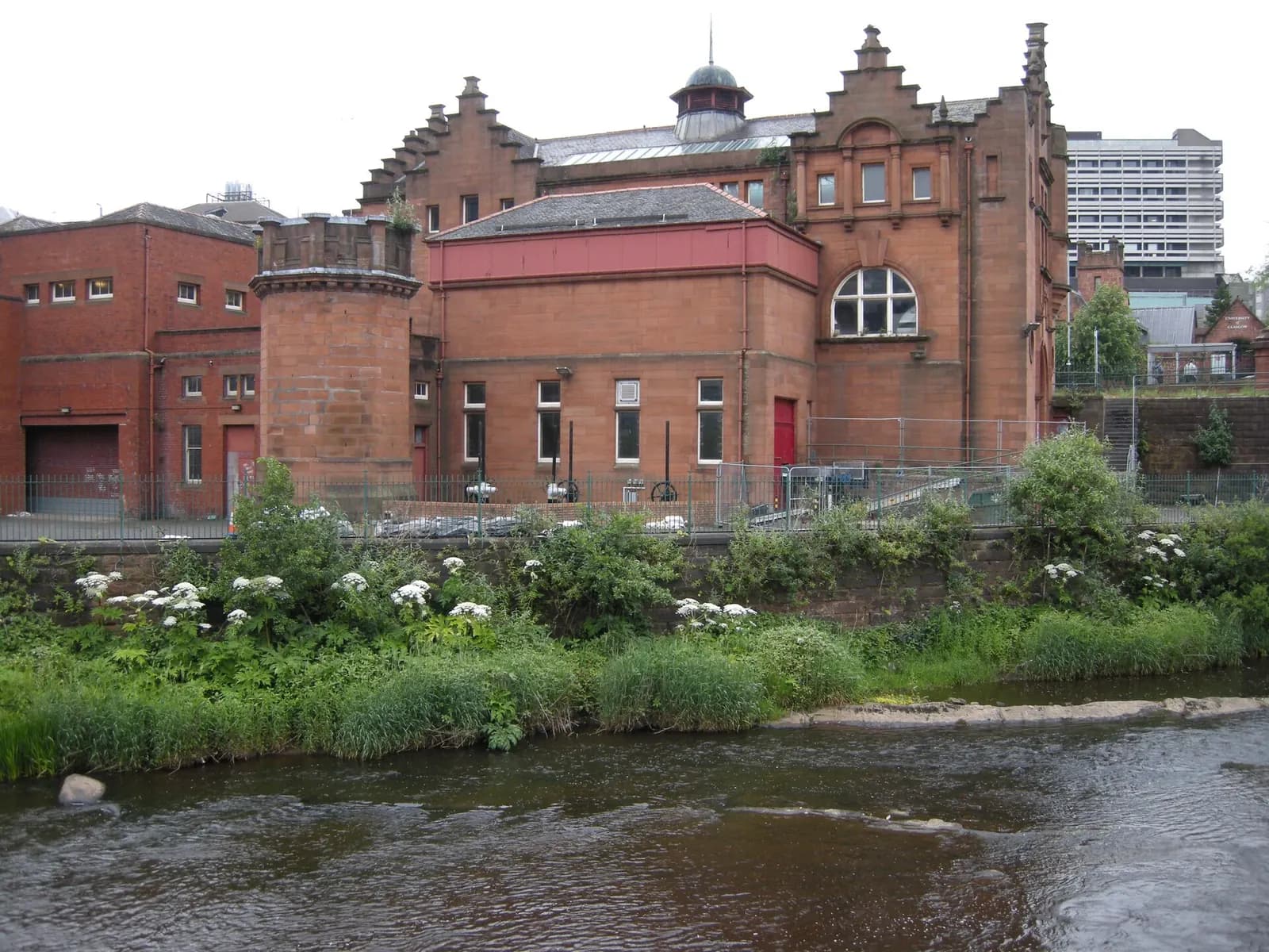 Red sandstone Partick sewage pumping station building beside the River Kelvin in Glasgow
